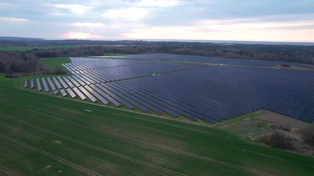 PV solar panels on large remote area in Polish countryside, solar farm aerial