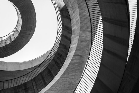 Fototapeta Geometric abstraction in the form of chaotic semicircles and arcs of different textures and from different materials. Black and white photo