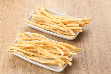 Cheese sticks, deep fried crispy savory snack, made from flour, cheese, butter and egg. Indonesian food
