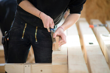 Carpenter sawing wood. man working with wood