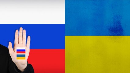 Hand gesture between Ukraine and Russia. Flag of Ukraine and Russia.