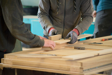 Carpenter sawing wood. man working with wood