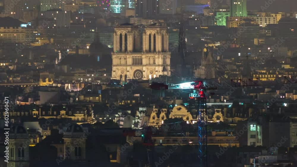 Wall mural Aerial panorama above houses rooftops in a Paris night timelapse. Top view with illuminated Notre Dame de Paris and Saint-Sulpice chathedral. Lights swithcing off