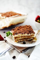 Homemade Tiramisu with ladyfingers base - italian dessrtm selective focus