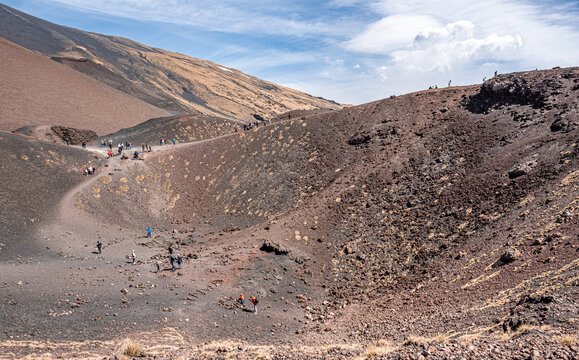 View of the Silvestri craters, two inactive volcano craters located at 1900 m ASL, below the top of Mount Etna volcano, easily accessible, the most visited parts  of the volcano, Sicily, Italy.