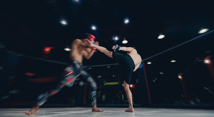 Fototapeta na wymiar MMA Boxers fighters in fights without rules in ring octagon, motion blur, dark background banner