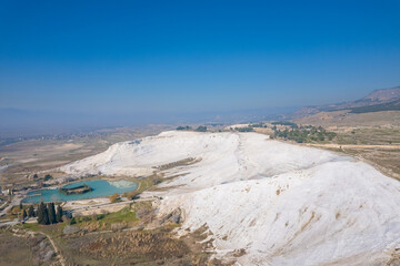 Pamukkale travertine pools, terraces with blue water, aerial top view. Concept travel landmark Turkey - obrazy, fototapety, plakaty
