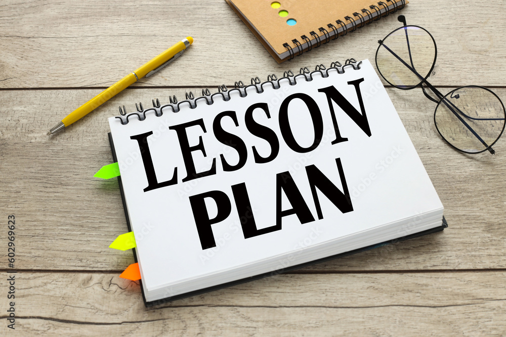 Aufkleber open notebook with stickers with text lesson plan on the table