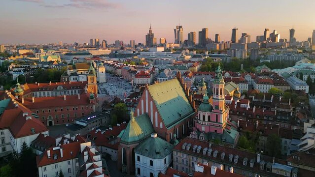 warsaw city old town aerial view at sunset drone moving out the window opening over historic center