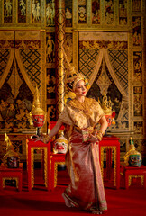 Vertical image of Asian woman wear Thai ancient traditional dress action of dancing in front of...