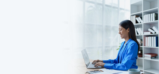 Fototapeta premium Excited businesswoman using computer laptop while in office, business concepts.