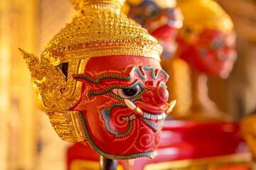 Close up beautiful ancient traditional Thai pattern Pantomime or Khon masks with main color of red...