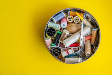 Sewing box isolated on yellow background.