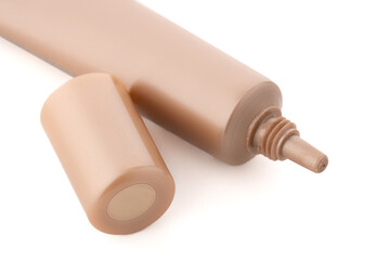Cosmetic tube on a white background. Decorative cosmetics. A tube of foundation, concealer, liquid shadows.