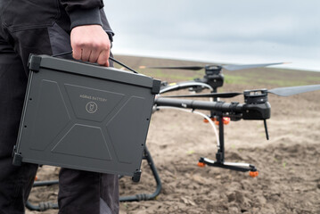 battery replacement by an agrodrone operator, copter maintenance, the latest technologies in agriculture