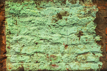 Old brick wall with dirty peeling paint. Close-up texture. Natural vintage background