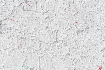 Light grunge cracked painted concrete wall, abstract background texture