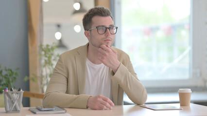 Thoughtful Young Businessman Thinking of New Idea