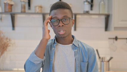 Portrait of Tired Young African Man with Headache