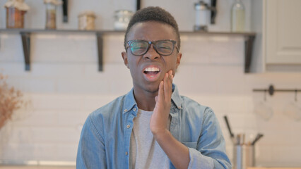 Portrait of Young African Man with Toothache