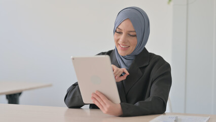 Online Video Chat on Tablet by Arab Businesswoman