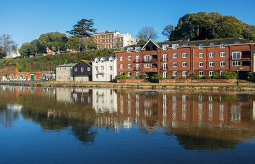 Skyline of the historic quayside of Exeter on the River Exe in Devon at sunrise, UK