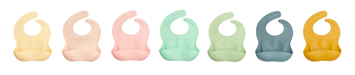 Baby bibs of different colors made of silicone on a white background