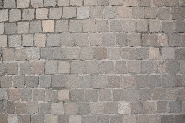 Stone pavement background. Natural natural material stone laid on the square.