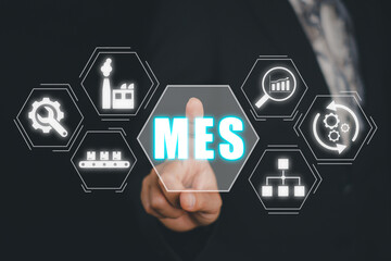 MES - Manufacturing Execution System concept, Businessman hand touching Manufacturing Execution...