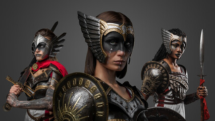 Shot of barbaric warriors women with spear and sword dressed in steel armors.