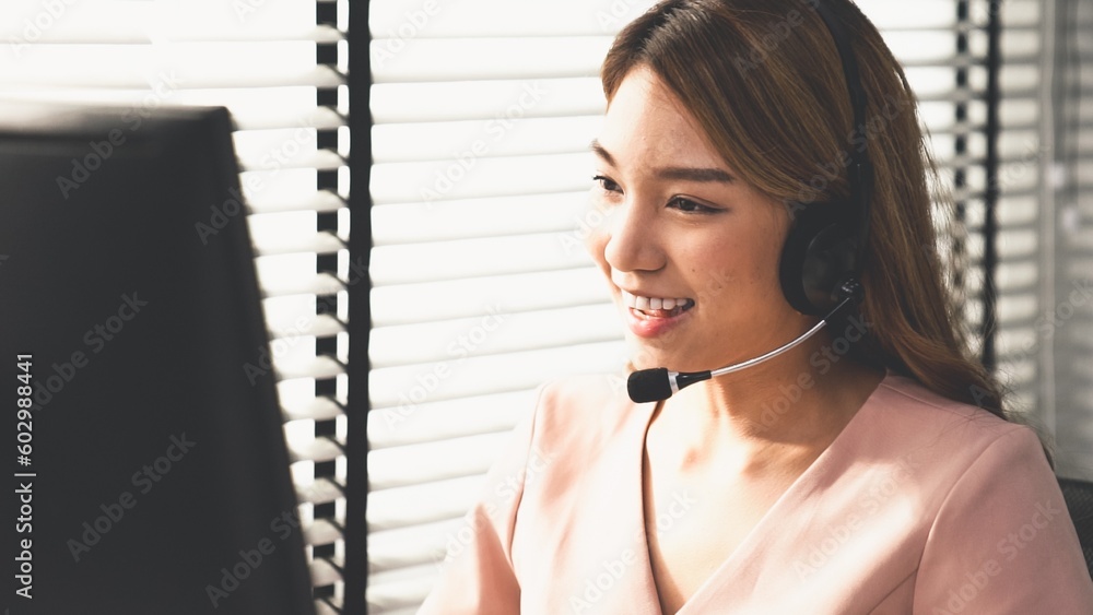 Aufkleber competent female operator working on computer and while talking with clients. concept relevant to bo