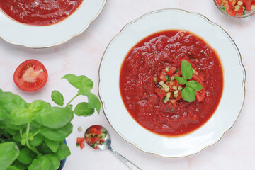 Plates with traditional gazpacho tomato soup