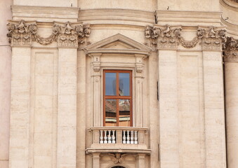 Fototapeta na wymiar Sant'Agnese in Agone Church Exterior Detail with Window and Balcony in Rome, Italy