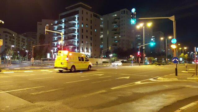 Ambulance on emergency call at night with sound of siren