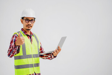 Portrait of Asian Male Engineer in white Hard hat using Laptop Computer Working on Interior Design with Isolated White Background