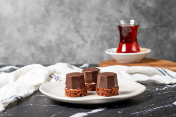 Cookies covered in milk chocolate. Liquid chocolate chip cookies on a dark background