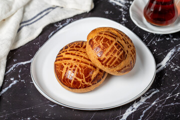 Pastry on dark background. Local name sade pogaca. Close up