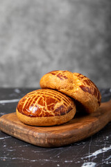 Pastry on dark background. Local name sade pogaca. Close up