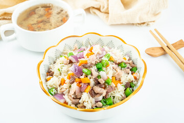 Chinese gourmet fried rice with colorful meat and stewed meat soup
