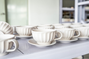 Ceramic biscuit mugs on an iron frame at Liling factory in China