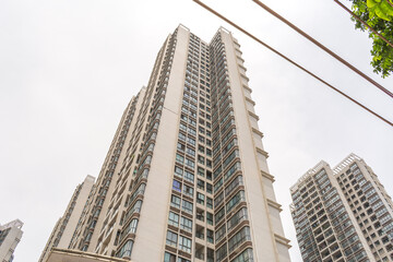 Obraz premium Beihai, China - July 18, 2019: Modern Chinese Apartment Building With Balconies in Residential Area
