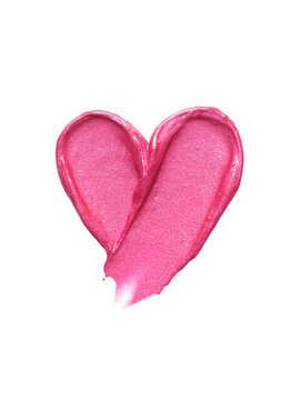Pink lipstick shimmering texture in heart shape, texture stroke isolated on white background. Cosmetic product swatch