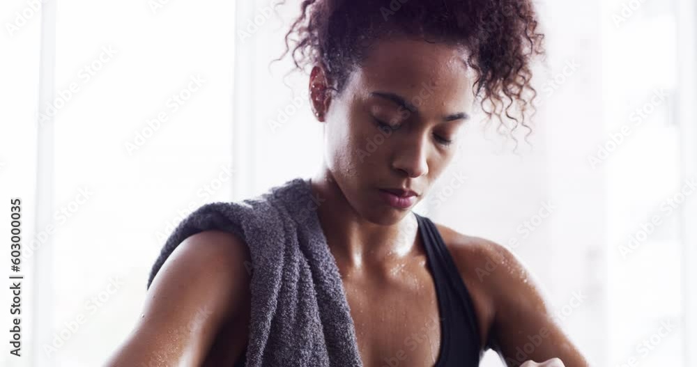 Wall mural Woman drinking water, exercise and relax after workout, sport and tired with hydration, health and wellness. Female athlete resting after fitness routine in gym, sweating and drink h2o from bottle