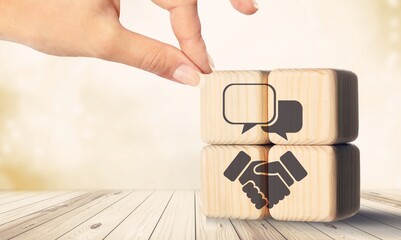 Negotiating business concept, set of wooden blocks