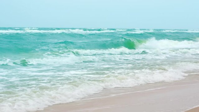 Beautiful stormy sea power water waves, horizon scene landscape by the coast of beach with breaking splash turquoise waves, mid shot, slow motion, hd. ProRes 422 HQ.