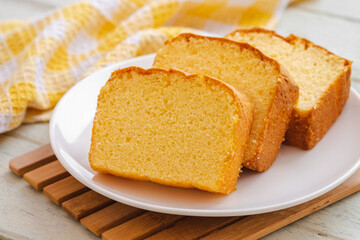 Butter cake sliced on white plate