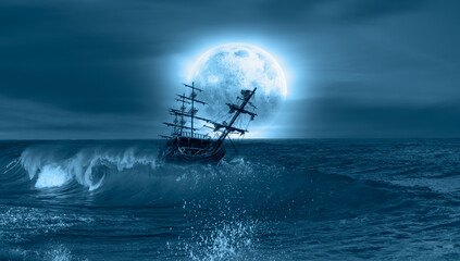 Sailing old ship in storm sea - Night sky with moon in the clouds 