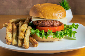 plant based burger with a side of broccoli fries