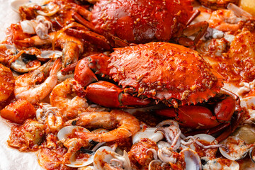 Crab sauce padang (Indonesian Kepiting Saus Padang). dish of crab served in hot and spicy Padang sauce.
