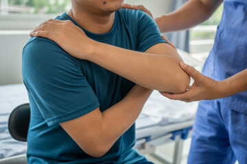 Fototapeta premium back and shoulder pain, Physiotherapy specialists help patients in physiotherapy. about Muscle Weakness and Fatigue